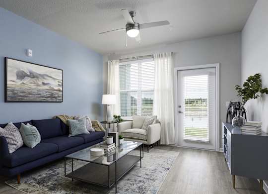an open living room with a blue couch and a coffee table