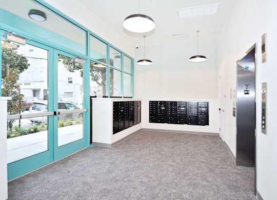 a hallway with blue doors and a door to a filing cabinet