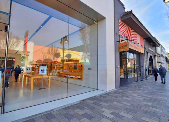 A storefront with a glass window and a sign that says