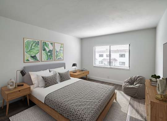 a bedroom with a large bed and a window