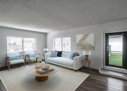 a living room with a white couch and a coffee table