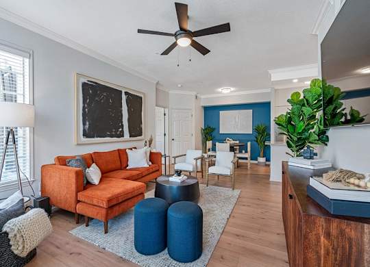 Spacious living room area with furniture and plank flooring