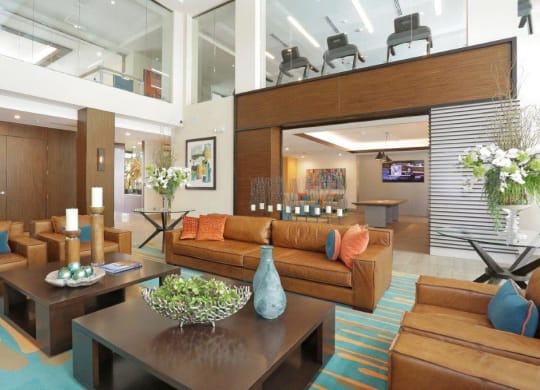 a large living room with couches and a table