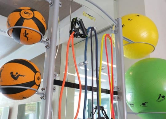 the inside of a bus with a bunch of balls on the ceiling