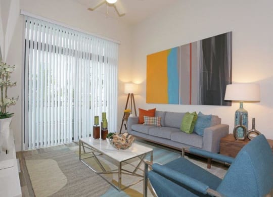a living room with a couch and a table
