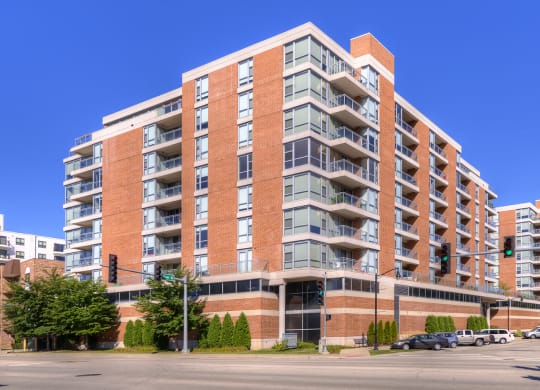 an apartment building on the corner of a city street