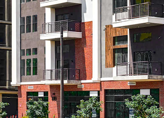 A modern building with balconies and windows.
