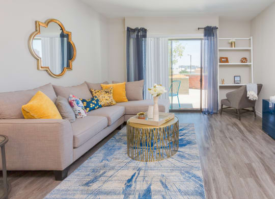 Apartment Living Room And Door To Patio At Union at Roosevelt Apartments In Phoenix, AZ