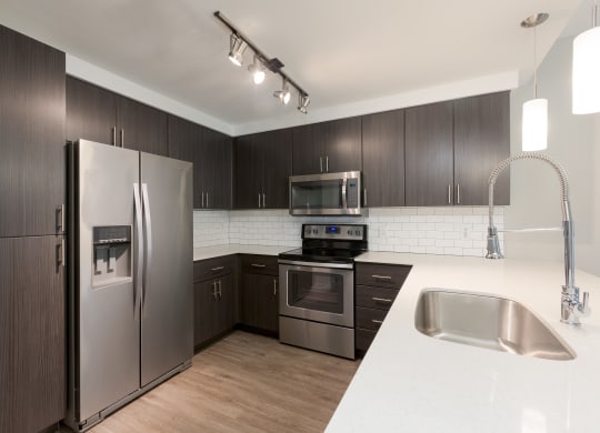 Stainless Steel Appliances And Modern Cabinetry At Union at Roosevelt Apartments In Phoenix, AZ