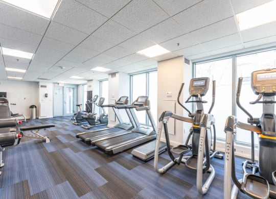 50 WB's gym with cardio equipment and weights in a building with windows