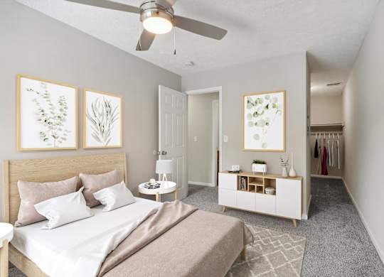 A bedroom with a bed, nightstand, and a ceiling fan.