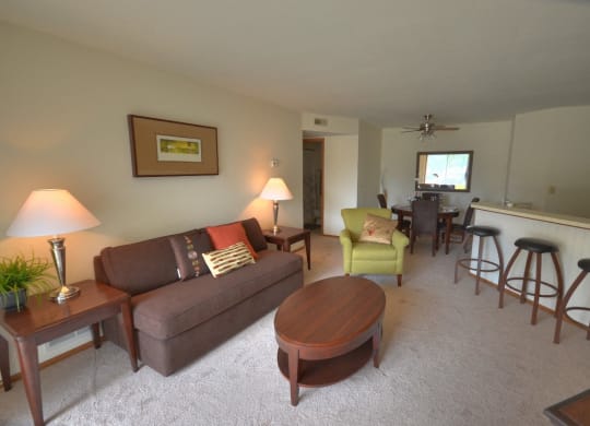 a living room and dining room with a couch and a table