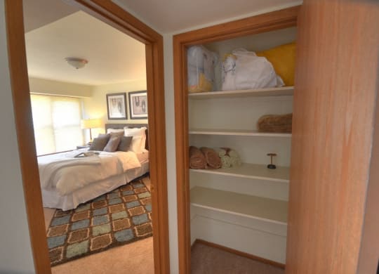 Hallway closet with shelves