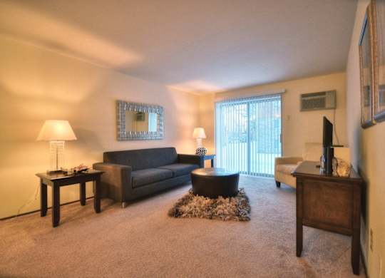 a living room with a couch and a table