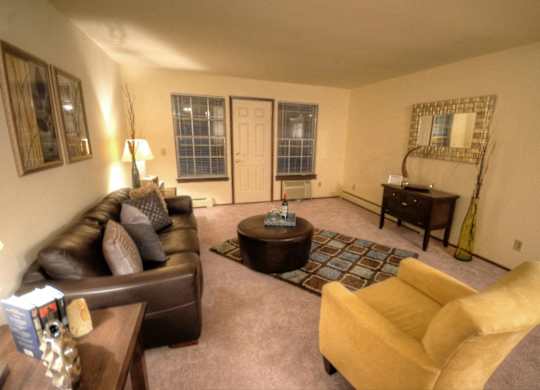a living room with a couch and a table