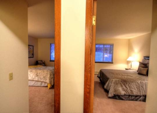 a bedroom with two beds and a window