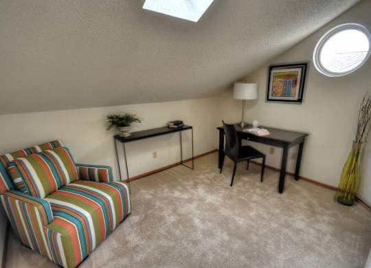 a living room with a couch and a table