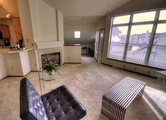 a living room with a couch and a fireplace