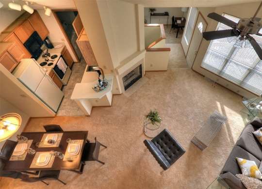 an overhead view of a living room with a ceiling fan