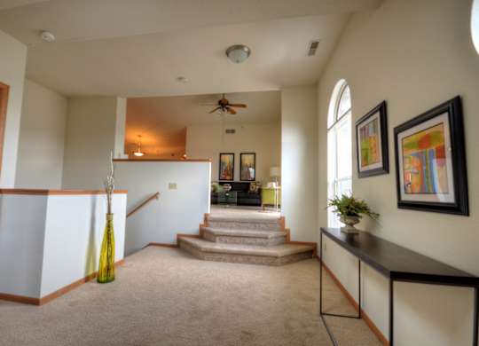 the view of the entryway from the living room into the dining room