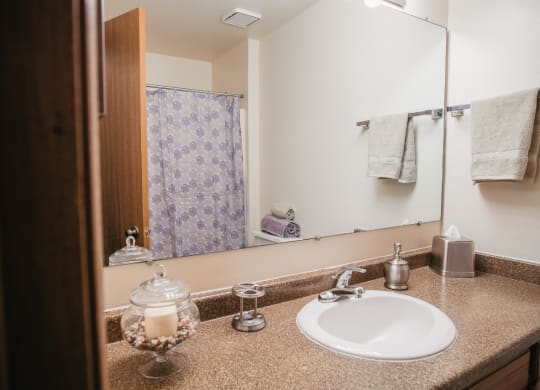 bathroom with tub, shower, sink vanity with under cabinets