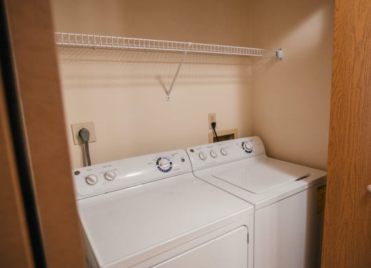 the washer and dryer in the laundry room of a home