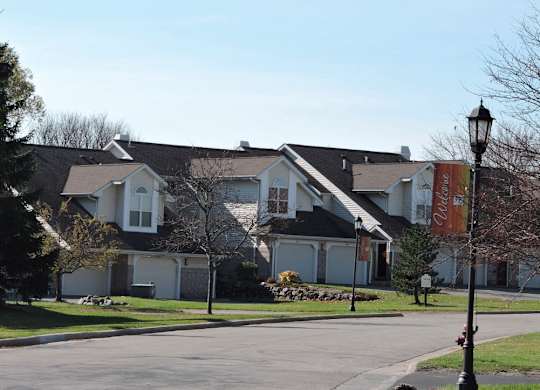 a row of houses on the side of a street