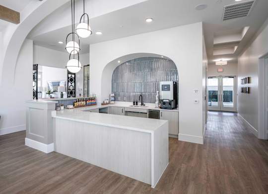 community kitchen with a large island and coffee bar