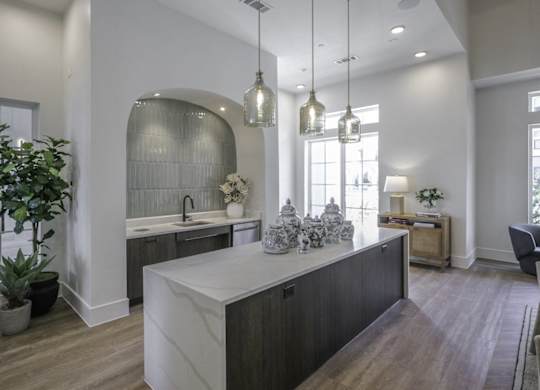 a kitchen with a large island in the middle