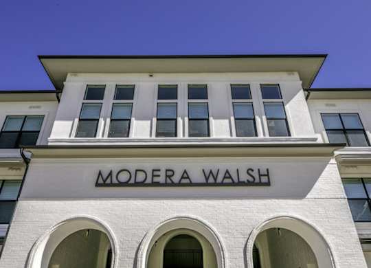 the facade of a building with a wall sign