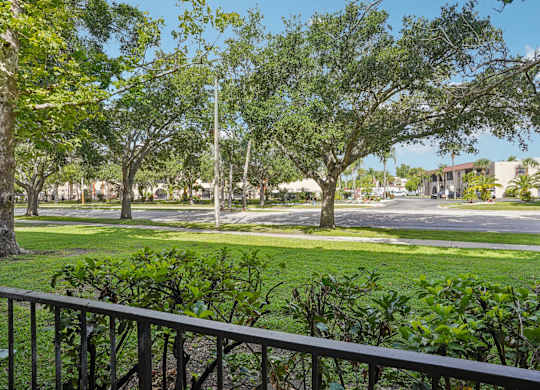 A view of a green lawn from a balcony.