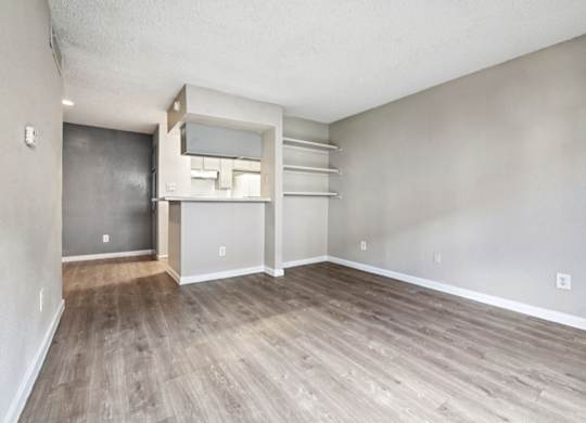 A room with a sliding door and a built-in shelf.