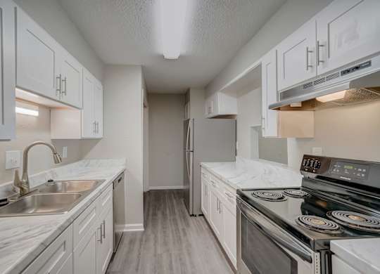 a modern renovated kitchen at Hills at Hoover Apartments