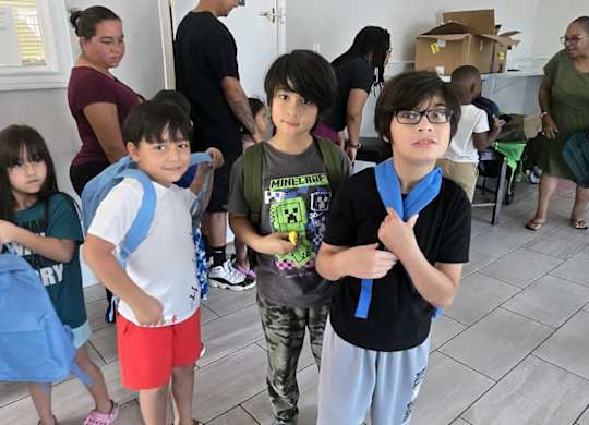 group of children are standing at Crosby at Westchase Apartments, Houston Texas
