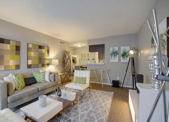 a modern living room with model furnishings at Crosby at Westchase Apartments in Houston