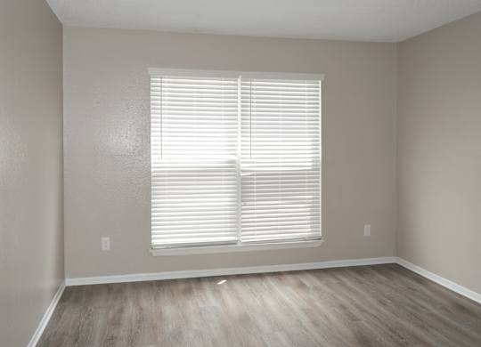 a bedroom with a large window at 12th and Beach