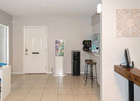 leasing office with water dispenser, coffee bar, and kitchen at Park Apartments