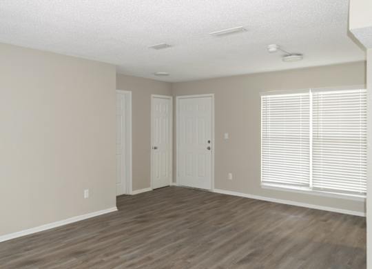 a spacious apartment at 12th and beach with wood-style flooring and large windows