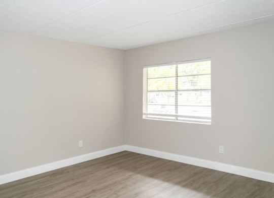 a bedroom with a window at Ridge Apartments