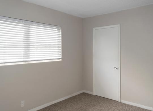 A bedroom with a window at Park Apartments