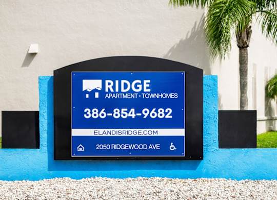 the monument sign in front of Ridge Apartments in South Daytona, FL