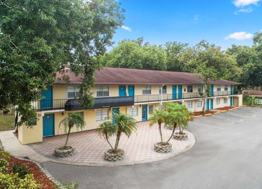 Residential buildings and parking lot at Ridge Apartments in South Daytona, FL
