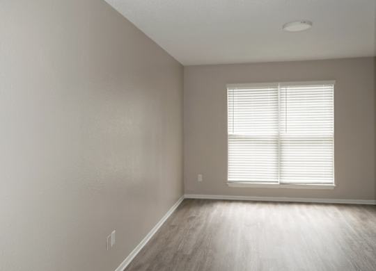 A spacious apartment bedroom available at 12th and Beach apartments in daytona beach