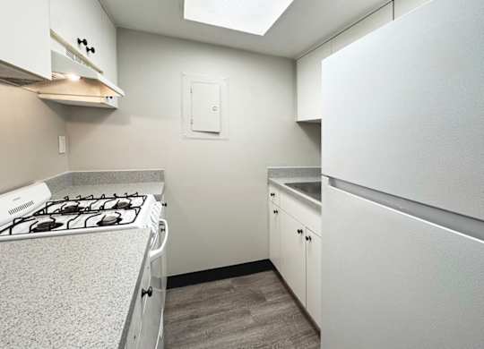 Haven on Canal classic one-bed, one-bath kitchen with white appliances