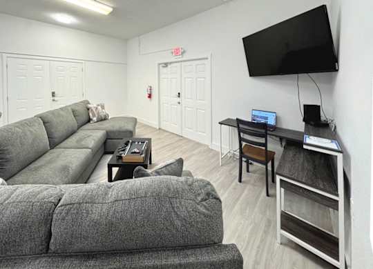 Haven on Canal's clubhouse with a couch and TV