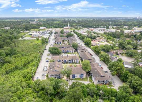 an aerial view of Pine Creek Apartments for rent in Houston, TX on Maxey Road