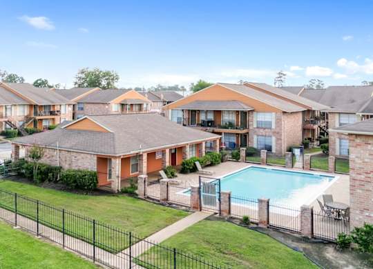 The pool, sundeck, clubhouse, and residential buildings at The Forest Apartments in Houston