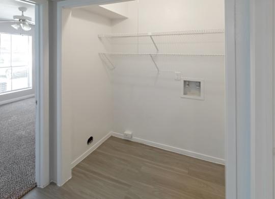 an area for a washer and dryer to be connected with built-in shelving in a Kirkwood Landing home