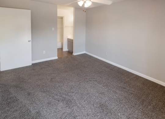 a carpeted bedroom in a Kirkwood Landing apartment home