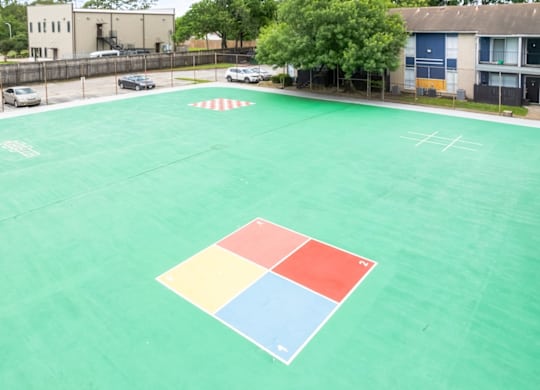 the spacious sports court at Pine Creek Apartments on Maxey Road